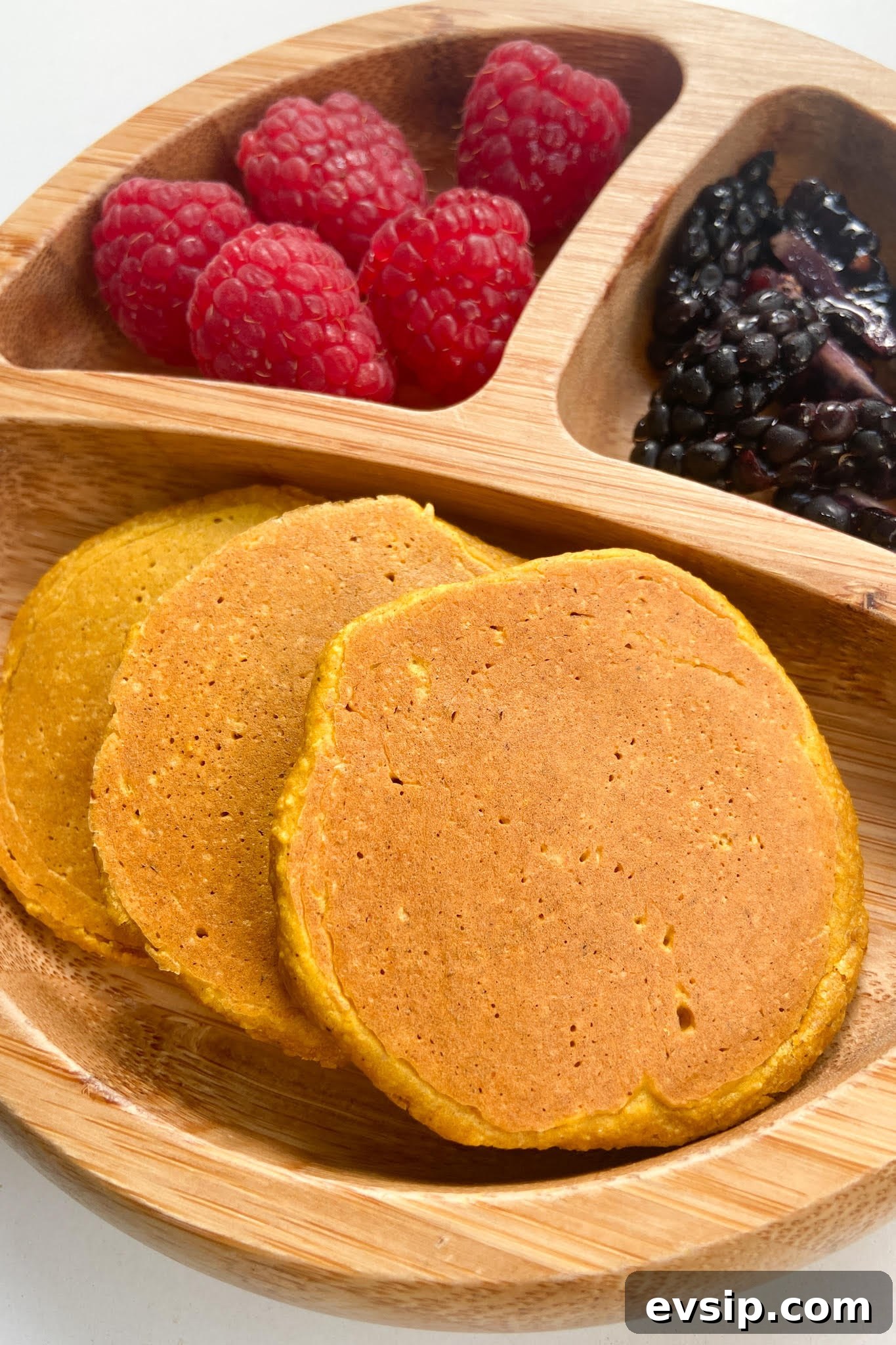 15 Kid-Friendly Pumpkin Recipes for Fall 9 Pumpkin pancakes served with raspberries and blackberries