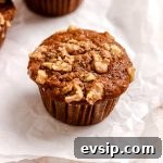 Banana walnut muffin on parchment paper.