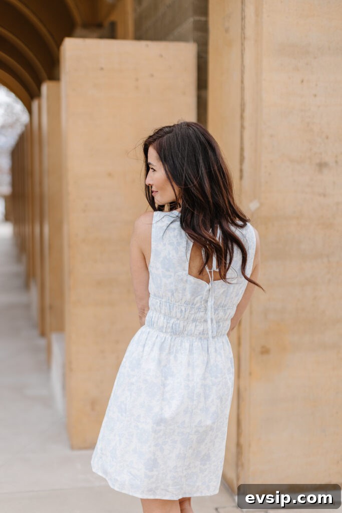 Tori showing the open back of her mini summer dress from The Fraîche x PRIV Summer Collection