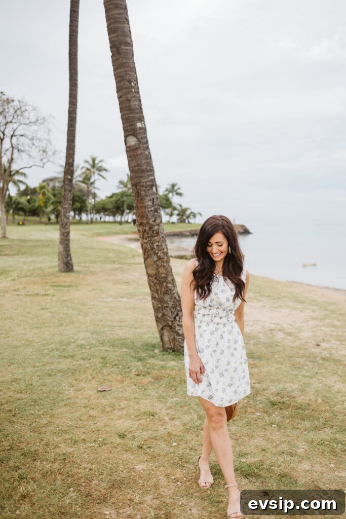 Tori in her blue and white mini dress on the grass in Hawaii from The Fraîche x PRIV Summer Collection
