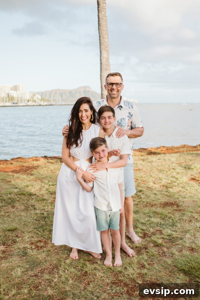 Tori and her family smiling on the beach in Hawaii