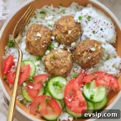 bowl with rice, meatballs, tomato and cucumber