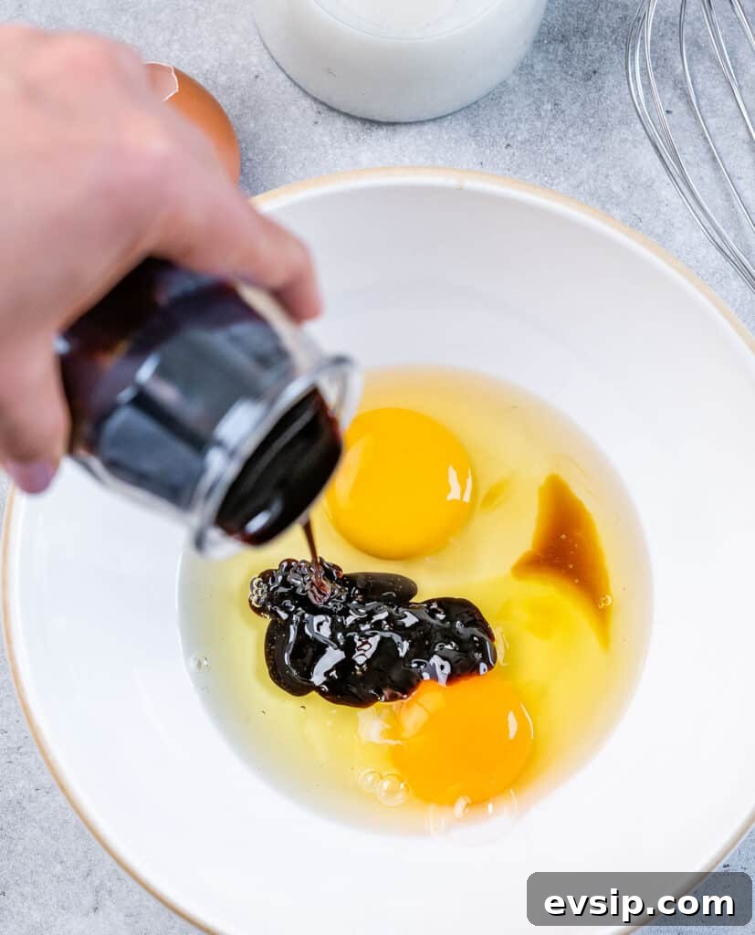 Adding molasses to eggs and vanilla in a bowl.