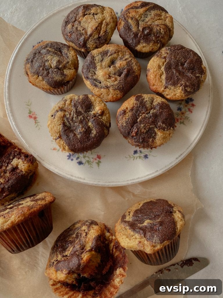 marble chocolate banana muffins on a floral plate