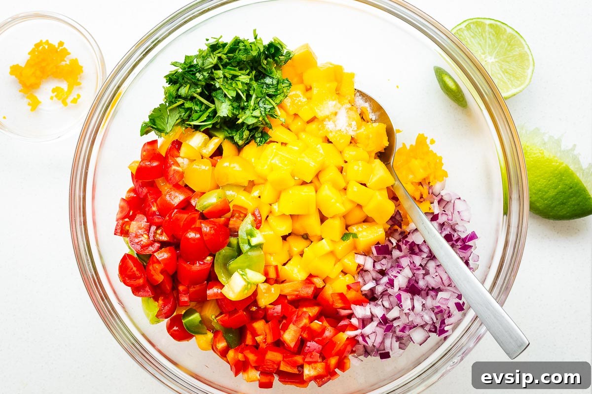 Mango Habanero Salsa Recipe — Fresh Homemade Fruit & Chili Salsa 5 Diced ingredients for fresh mango habanero salsa in a glass bowl.