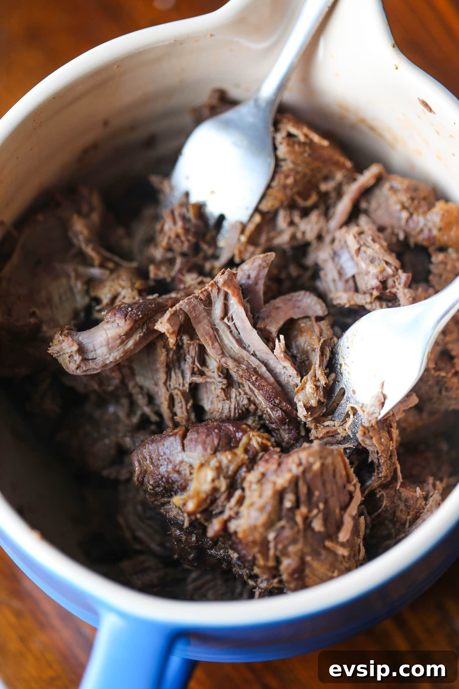 Savory Beef and Noodle Stir-Fry Recipe for Weeknight Dinners 6 shredding beef with forks
