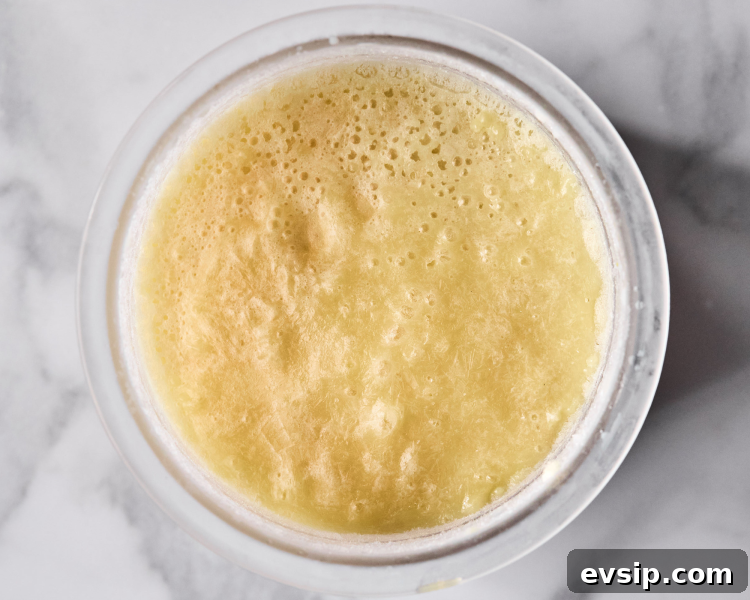 Vanilla protein ice cream frozen in ninja creami pint container after freezing for 24 hours.