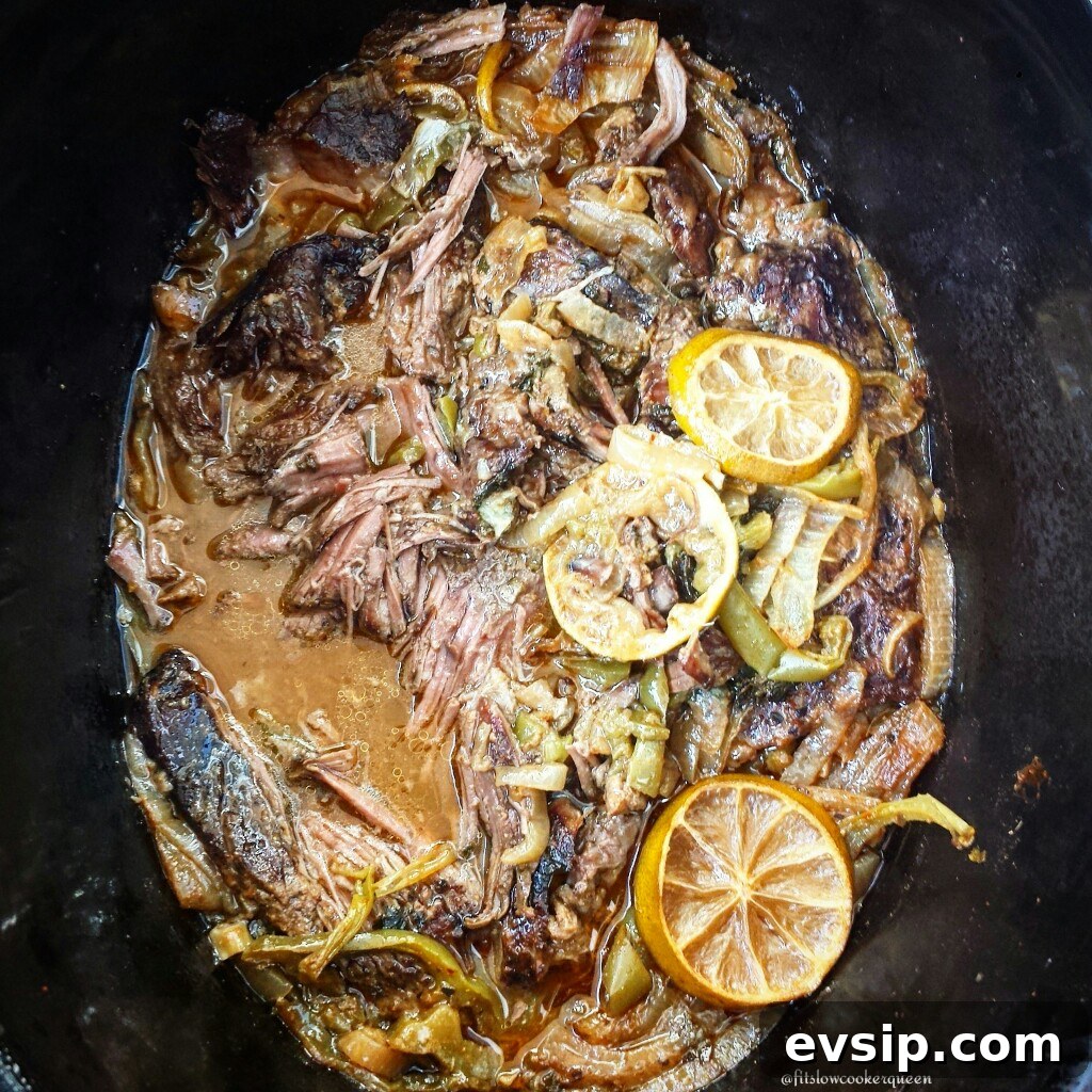 overhead shot of cilantro lime beef in a black slow cooker