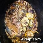 overhead shot of cilantro lime beef in a black slow cooker