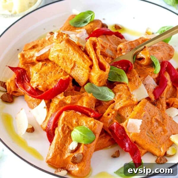 Red pepper pasta on a plate.