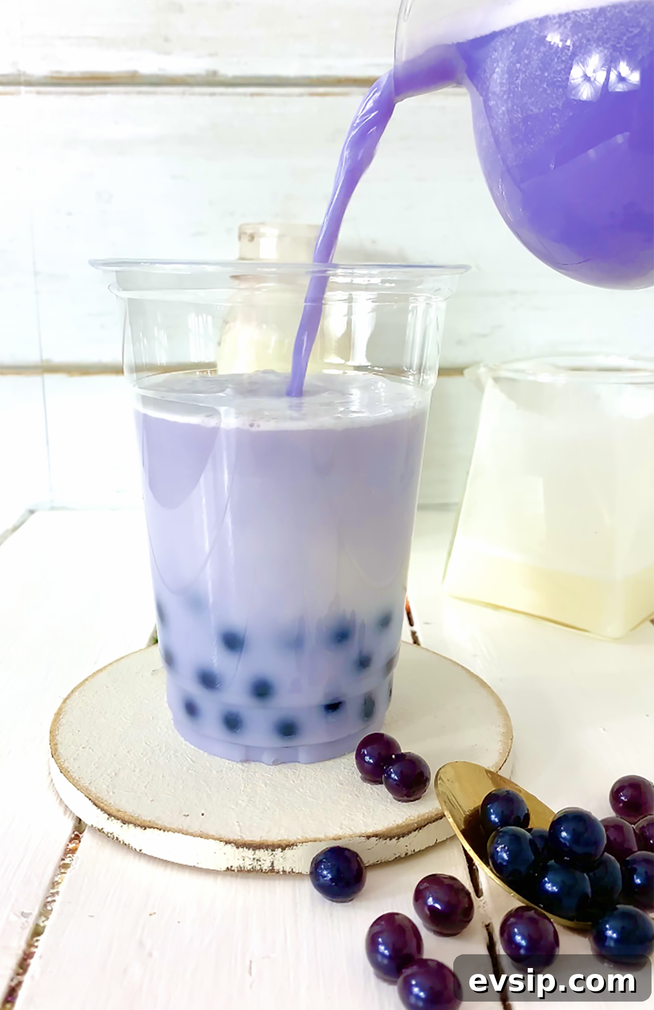 pouring milk tea into boba