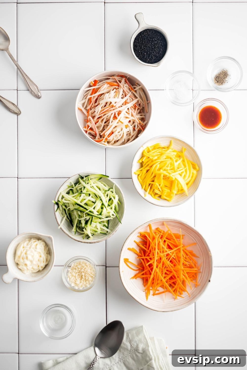 Shredded ingredients in bowls on a white tile counter.
