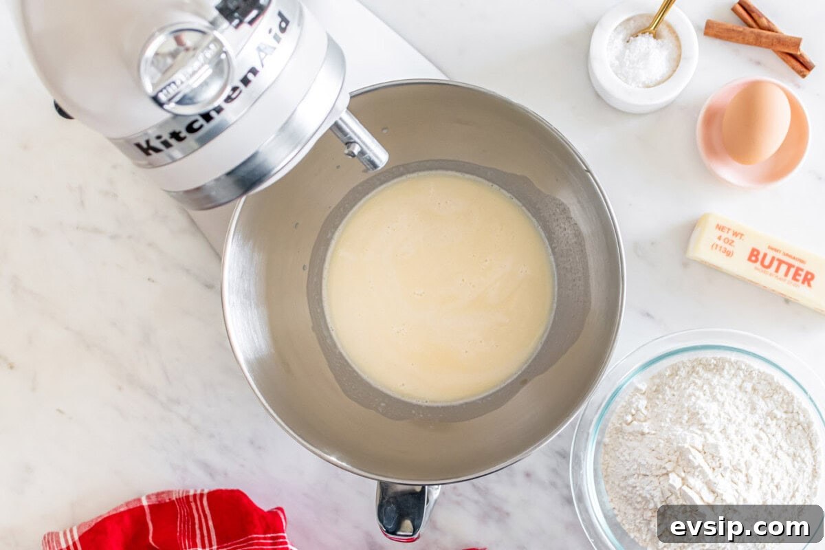 active yeast with milk in a stand mixer bowl