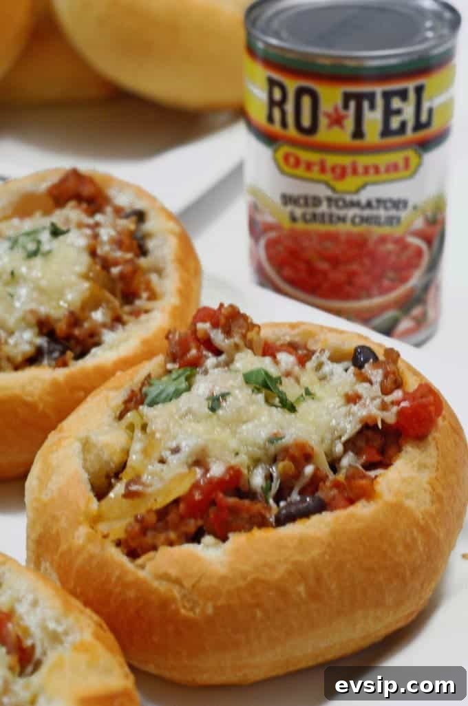 Parmesan Sausage Stuffed Bread Bowls Recipe 3 A close up of parmesan sausage bread bowl