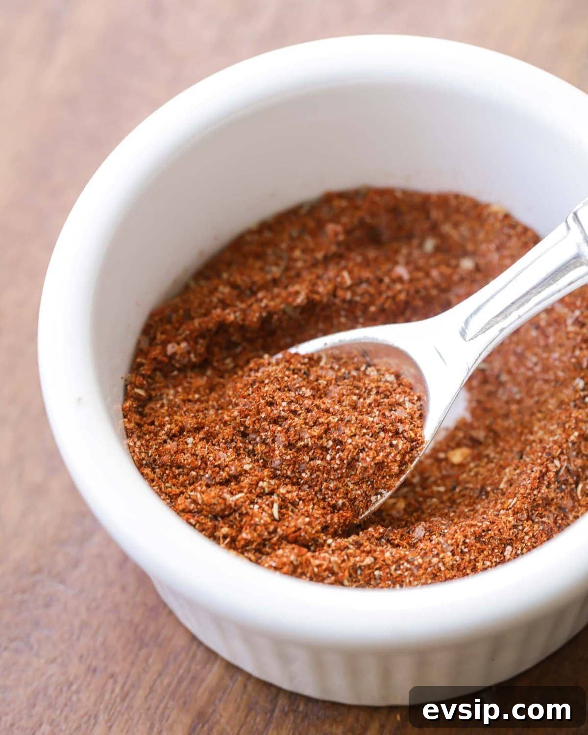 Homemade taco seasoning is simple, made with ingredients that are usually on hand. It gives a delicious flavor to any recipe!! DIY Taco Seasoning Recipe stored in a white bowl.
