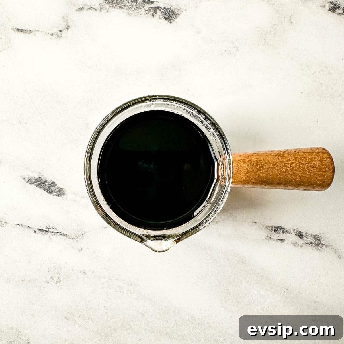 How to Make a Rich Balsamic Reduction for Glazes and Drizzles 3 Balsamic Vinegar in Small Pitcher with wooden handle.