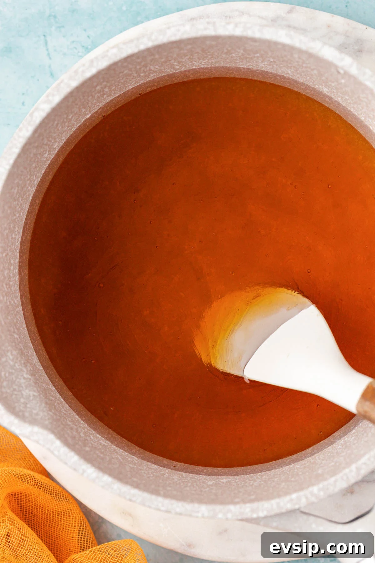 Honey simple syrup being prepared in a pot.