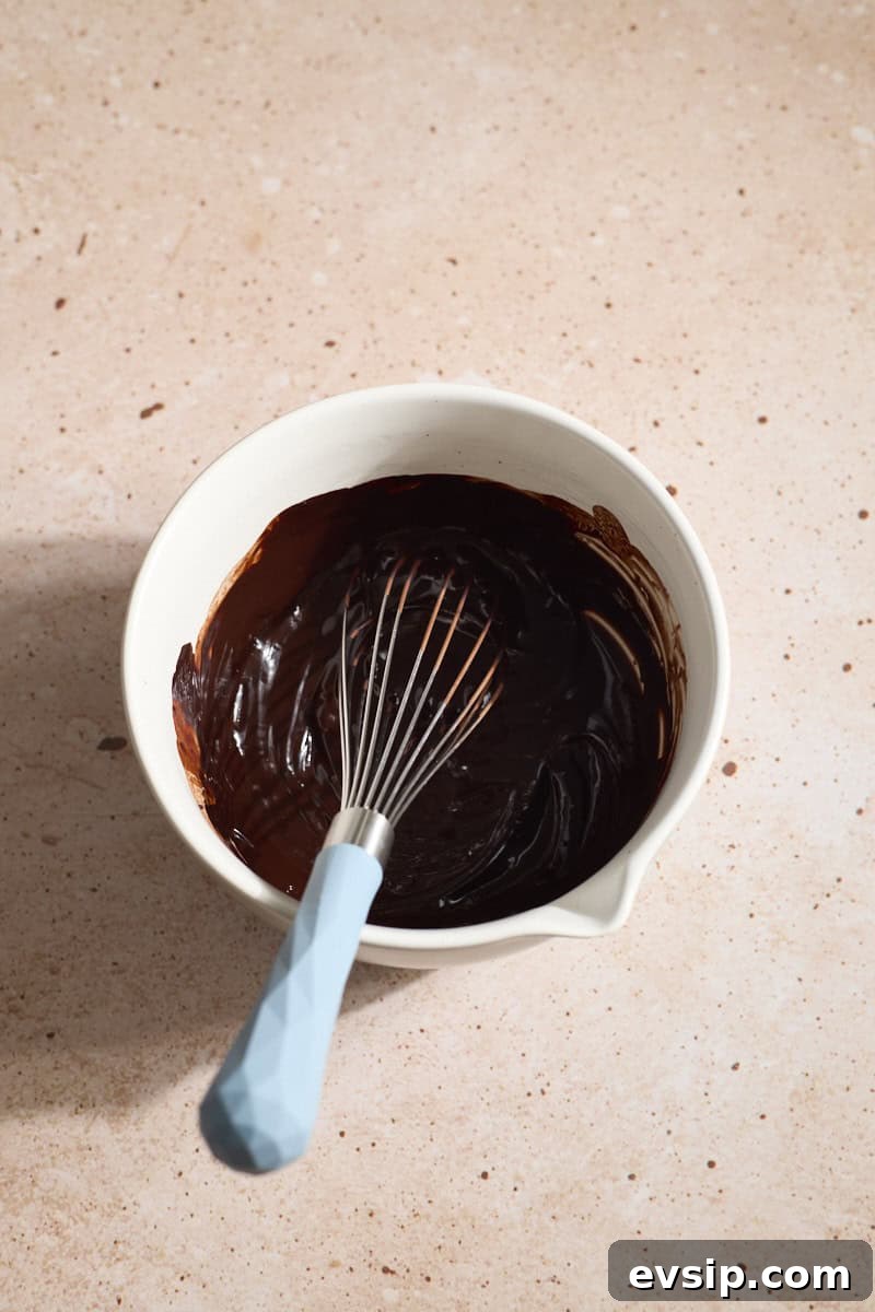 Chocolate Marshmallows Recipe: Homemade Gooey Chocolate Mallows 4 Chocolate mixture in a small bowl with a whisk.