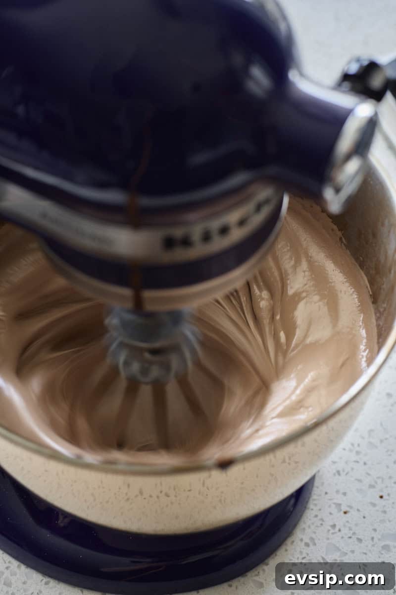 Chocolate Marshmallows Recipe: Homemade Gooey Chocolate Mallows 8 Marshmallow being whipped in the bowl of a stand mixer.