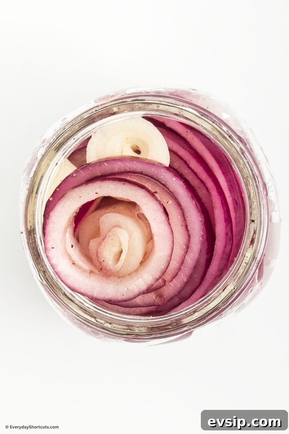 Tangy Quick-Pickled Red Onions for Salads and Sandwiches 6 thin sliced onions in a mason jar