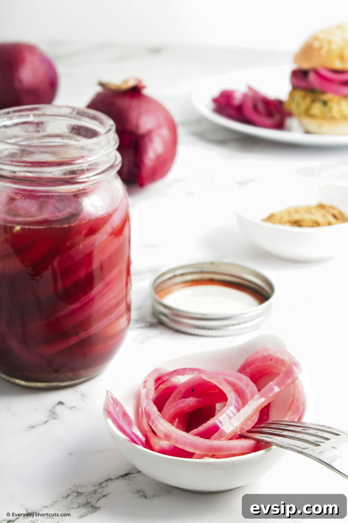 Tangy Quick-Pickled Red Onions for Salads and Sandwiches 9 pickled red onions in a bowl