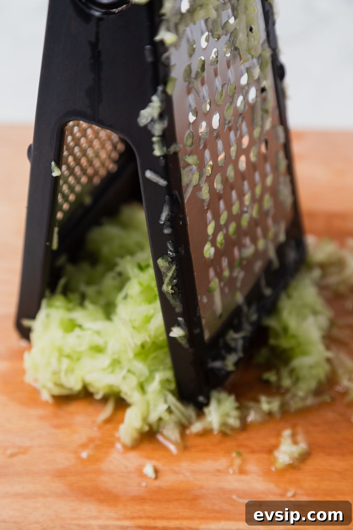 grating the cucumber.