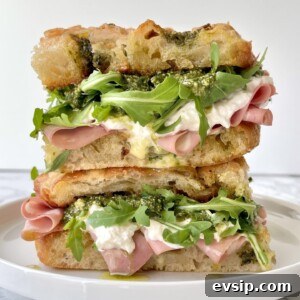 Mortadella & Burrata Sandwich Recipe – Creamy Italian Panino 11 mortadella burrata sandwich with rocket, pesto, stacked on a plate