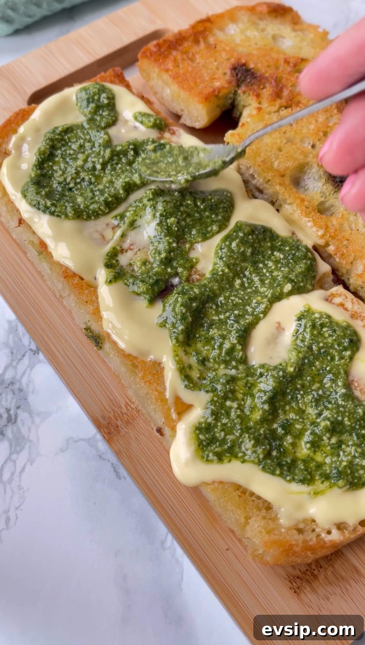Mortadella & Burrata Sandwich Recipe – Creamy Italian Panino 7 adding pesto to mortadella burrata sandwich