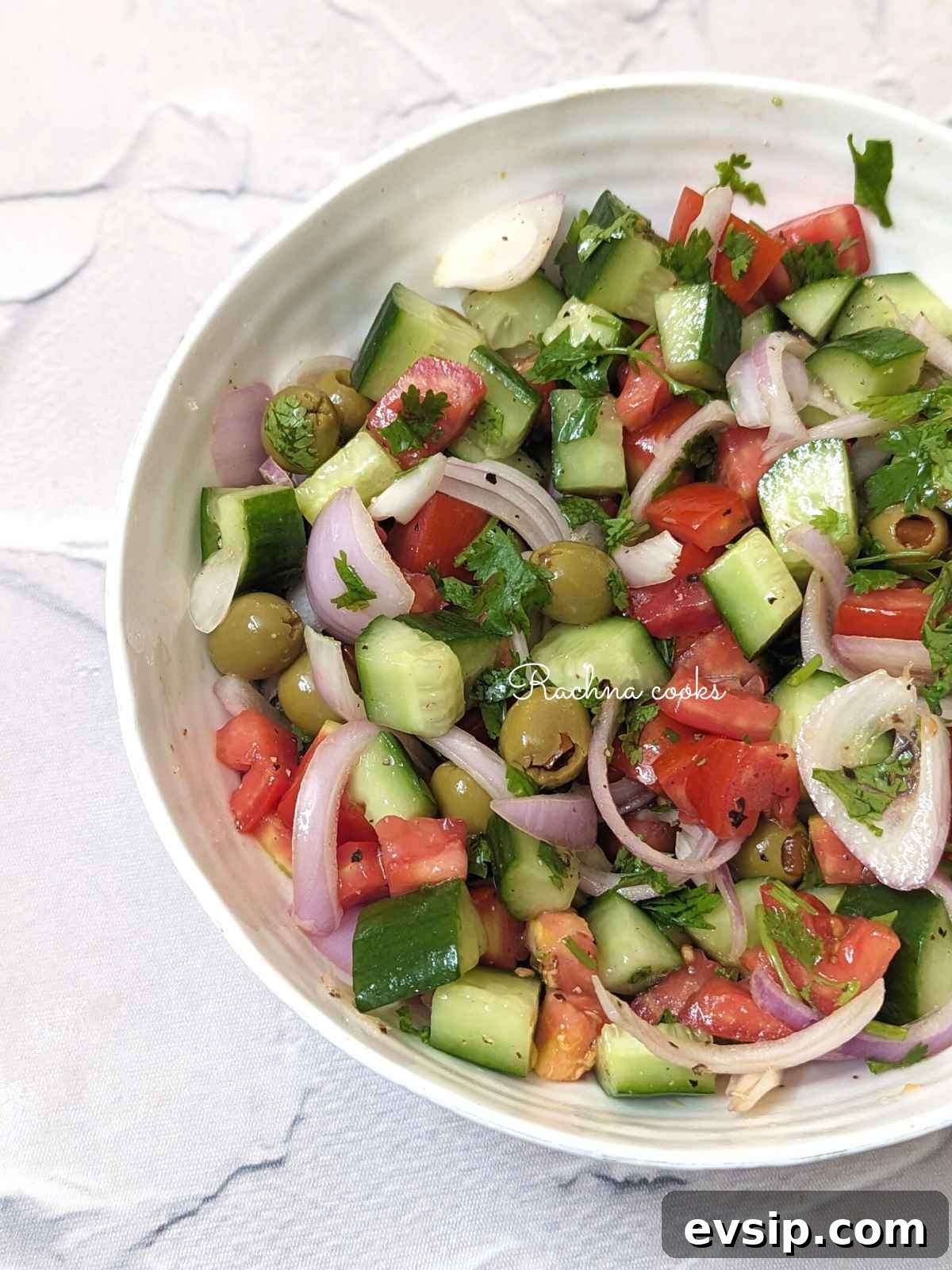 Mediterranean Cucumber and Tomato Salad Recipe for Summer 3 A bowl fo Mediterranean cucumber tomato salad.
