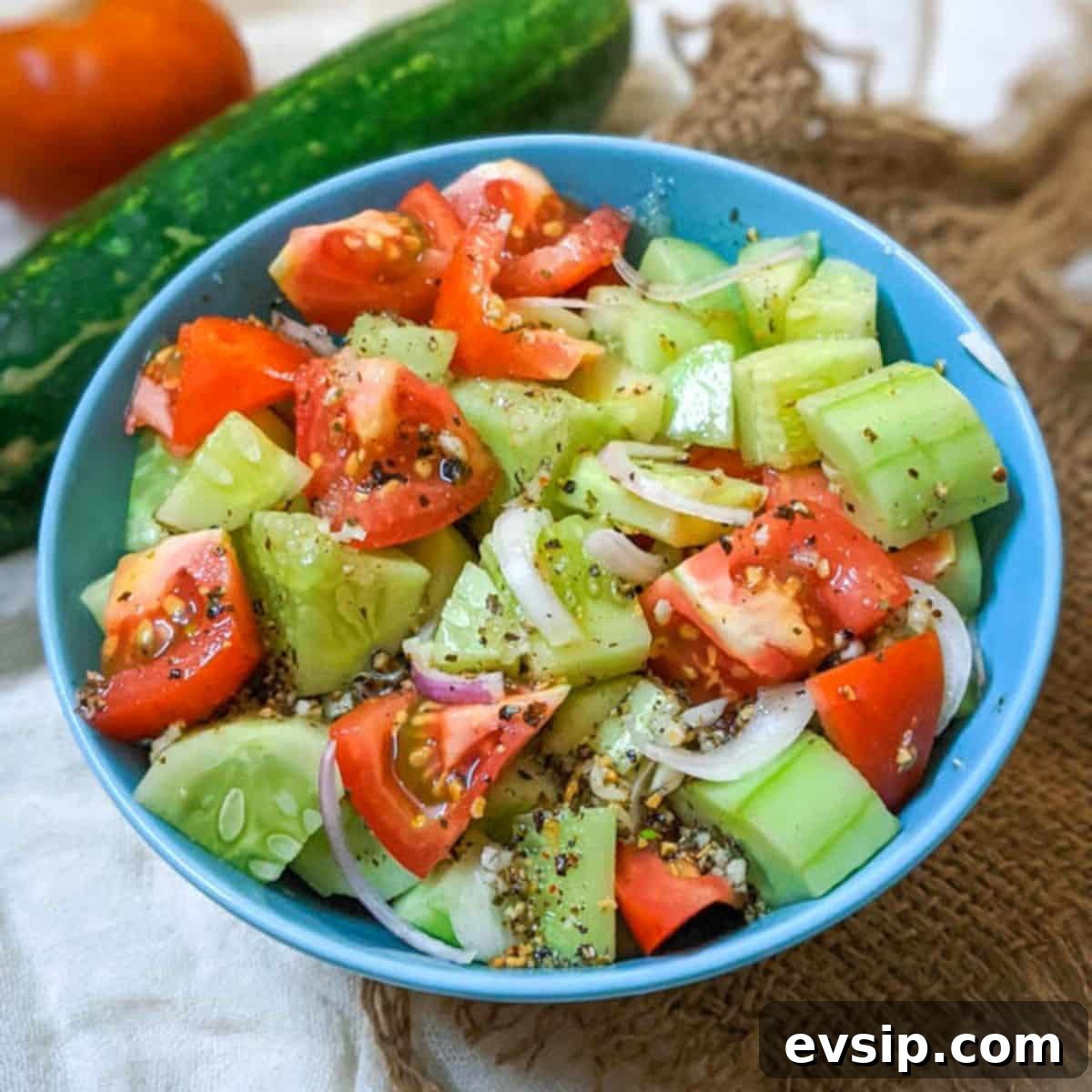 Mediterranean Cucumber and Tomato Salad Recipe for Summer 5 Delicious cucumber tomato salad in a blue bowl