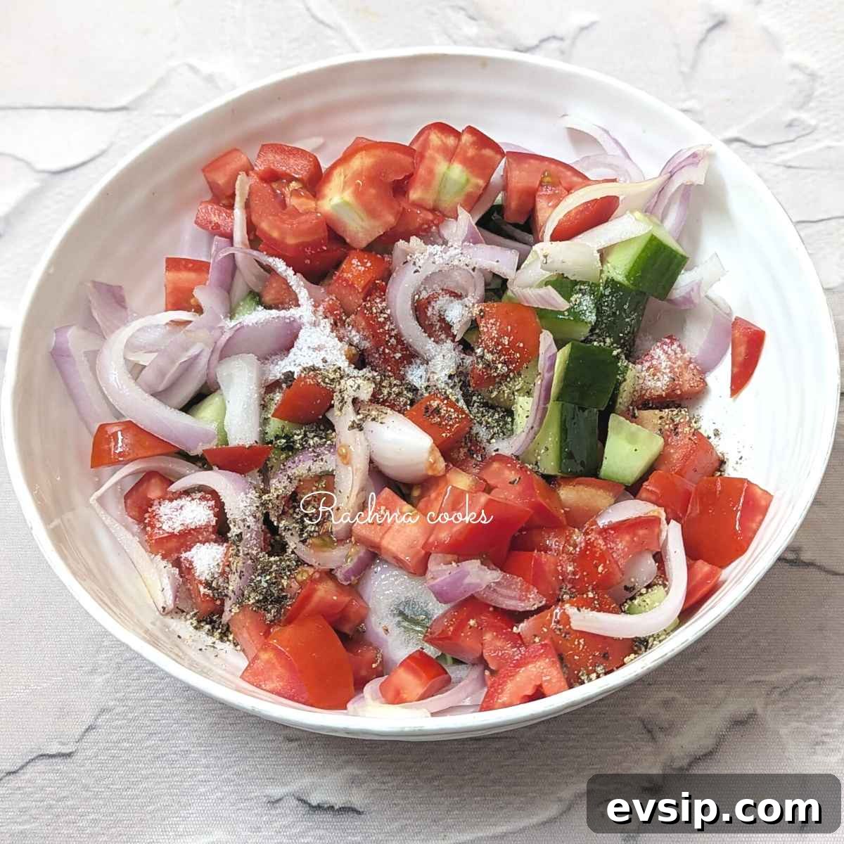 Mediterranean Cucumber and Tomato Salad Recipe for Summer 8 Diced tomato, cucumber and onions with salt, pepper and olive oil and red wine vinegar.