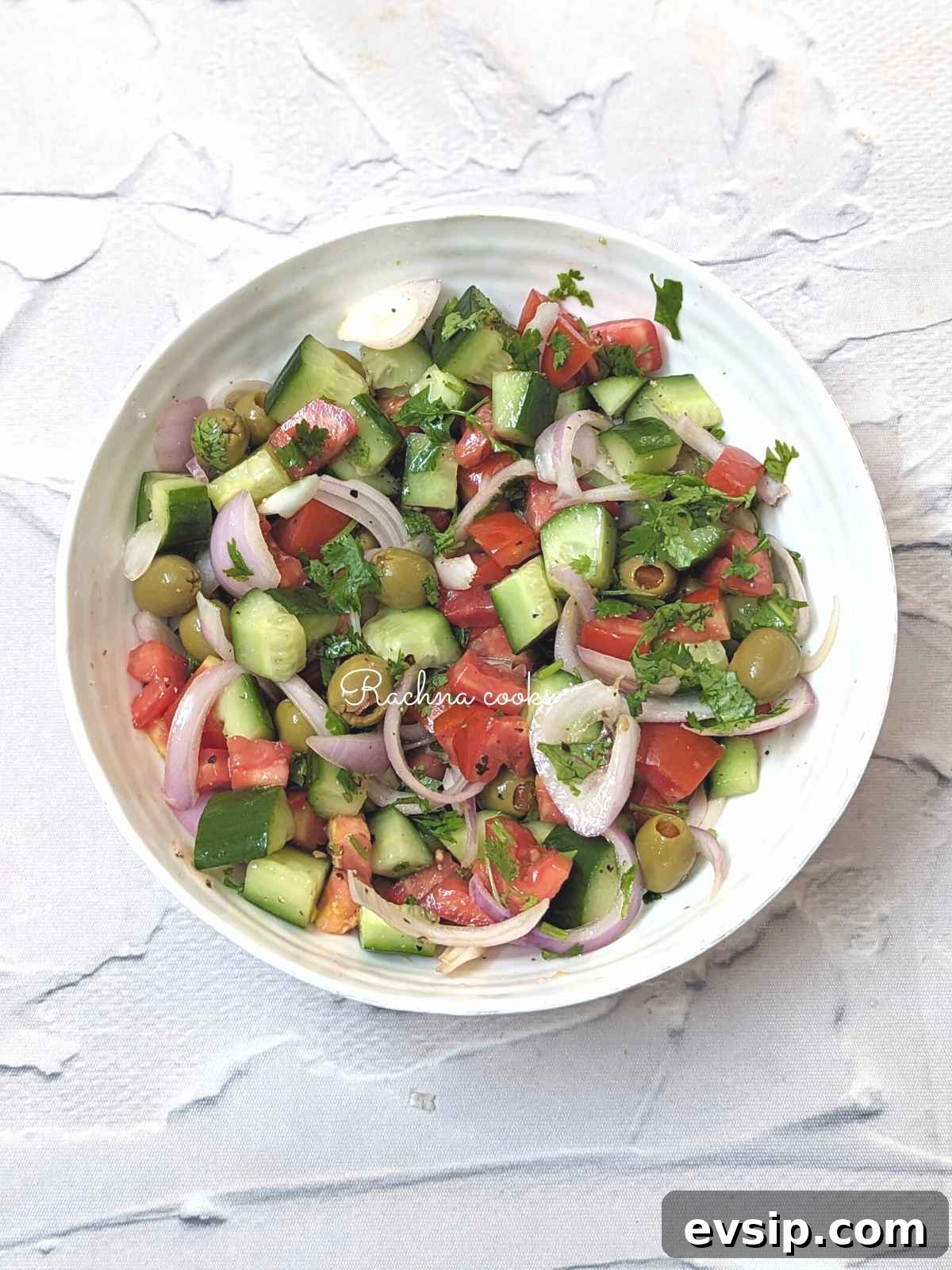 Mediterranean Cucumber and Tomato Salad Recipe for Summer 10 Mediterranean cucumber tomato salad served in a bowl.