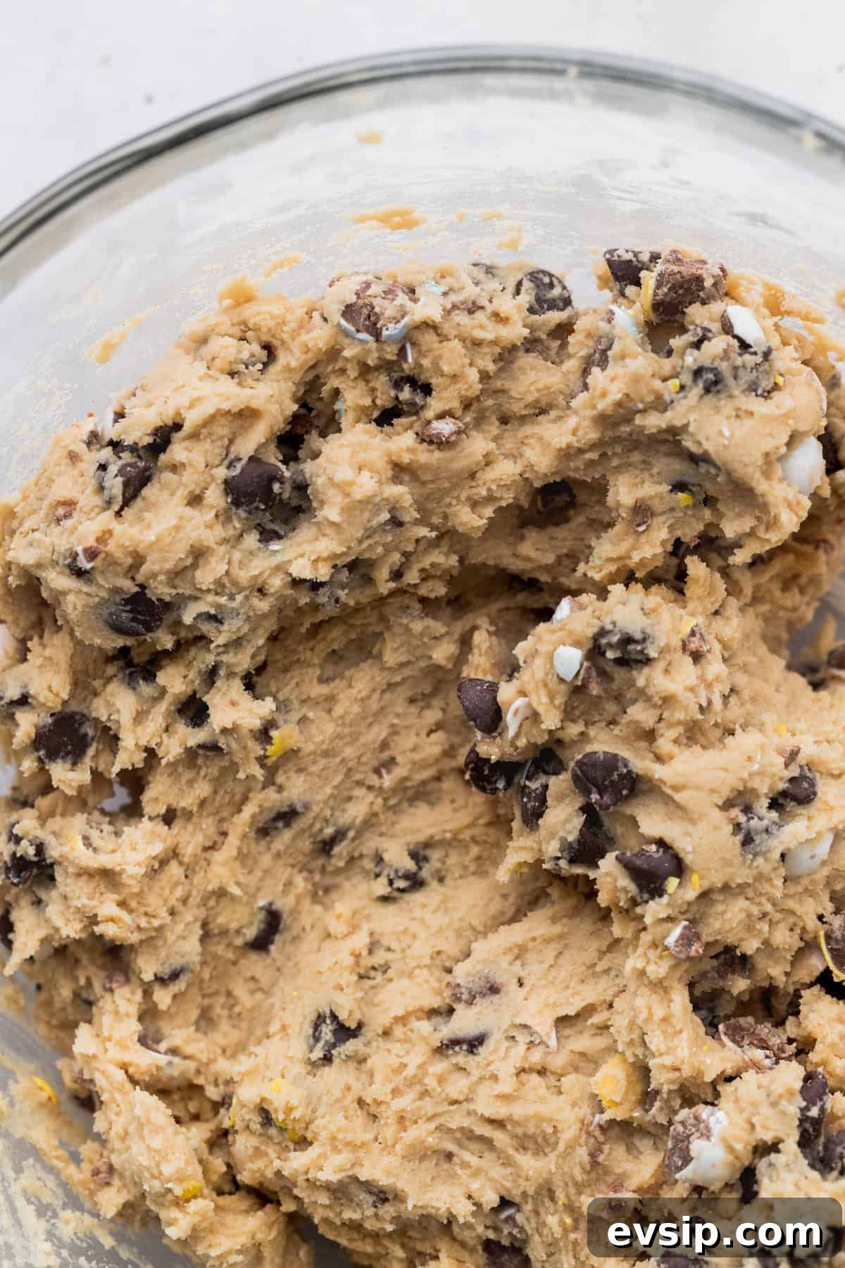 Bite-Sized Mini Egg Cookies with Chocolate Candy Centers 6 Cookie dough in a glass bowl