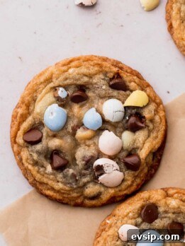 Bite-Sized Mini Egg Cookies with Chocolate Candy Centers 10 Mini egg cookies on parchment paper.