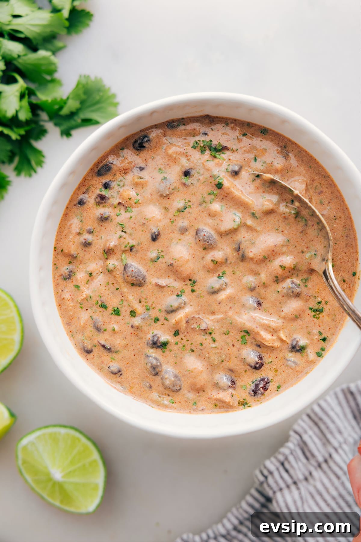Ready-to-Enjoy Crock Pot Green Enchilada Chicken Soup with Fresh Herbs Serve green chicken enchilada soup in a bowl and enjoy.