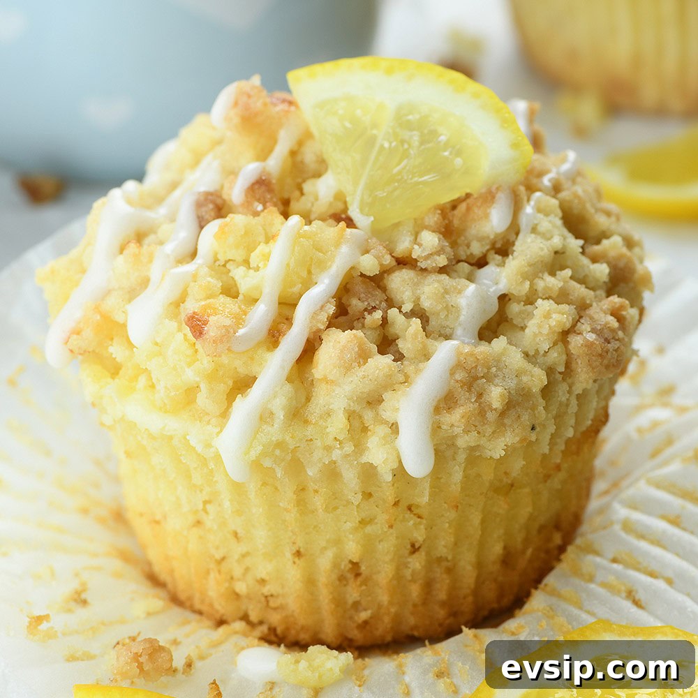 lemon streusel muffin with glaze and cream cheese filling whole muffin close up