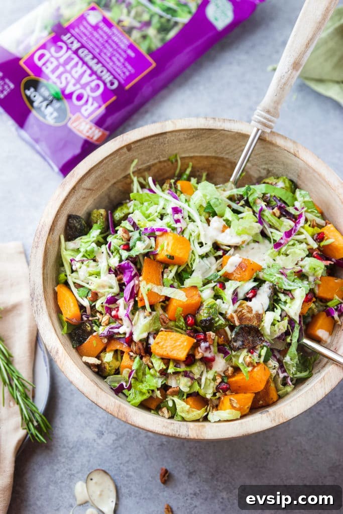 Roasted Garlic Vegetable Salad with Balsamic Vinaigrette 2 Various vegetables with dressing in a large wooden bowl with serving spoons