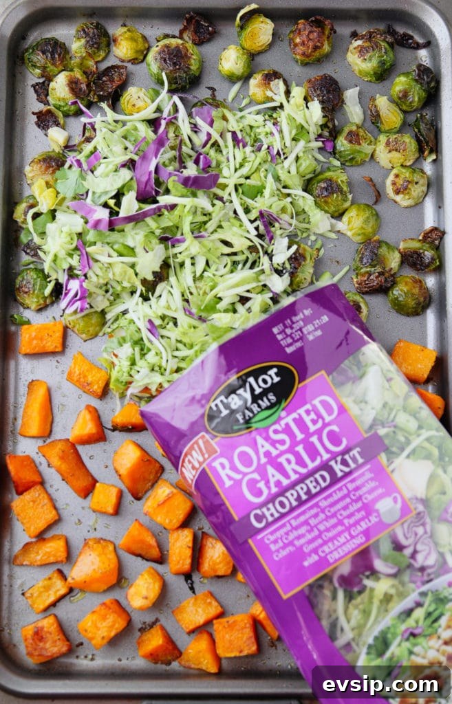 Roasted Garlic Vegetable Salad with Balsamic Vinaigrette 4 Roasted vegetables on a sheet pan and some mixed greens added to it from its packaging