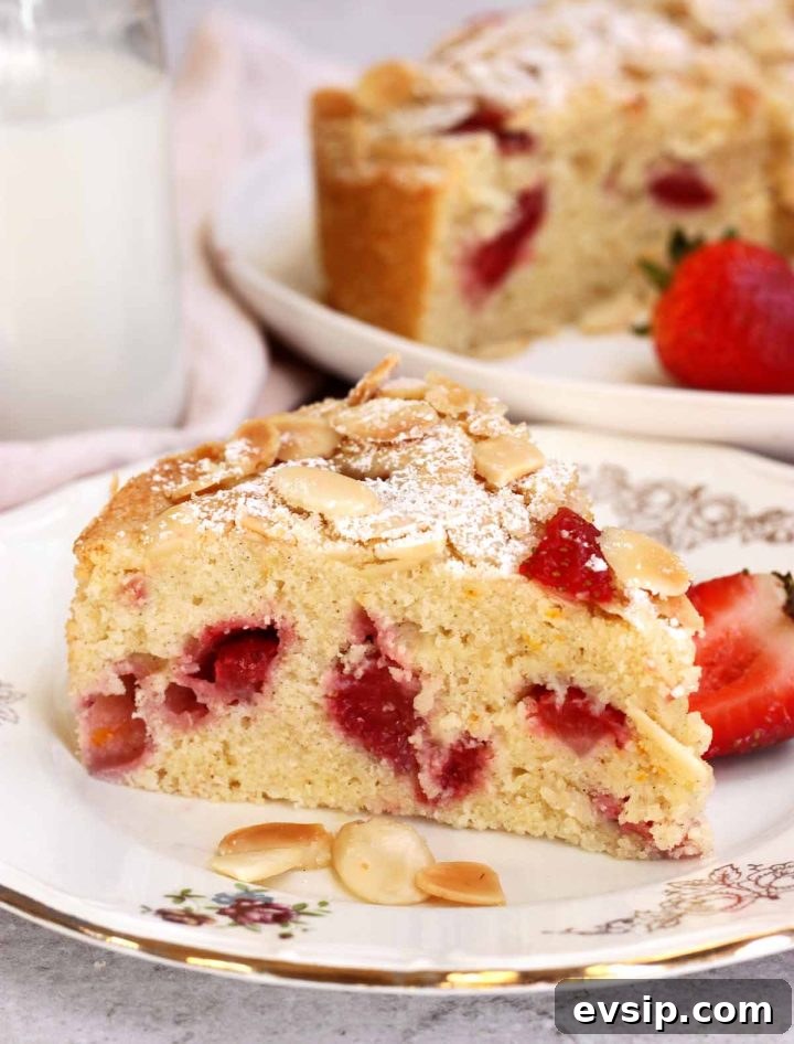 Strawberry Almond Cake Recipe with Almond Glaze 8 strawberry almond cake slice on plate