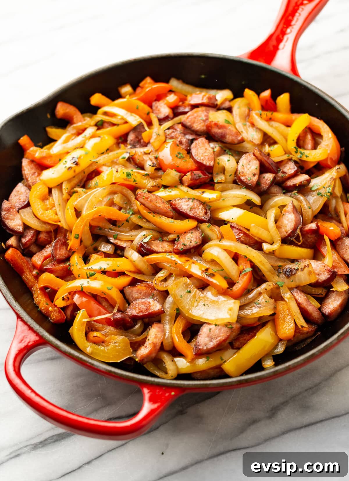 One-Pan Sausage and Peppers Skillet Recipe 2 a cast iron skillet with sausage and peppers