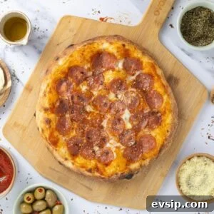 20 Sourdough Discard Recipes Perfect for Freezing 13 A sourdough discard pizza made with sourdough discard pizza dough that has been topped with pepperoni and mozzarella.