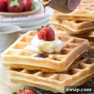20 Sourdough Discard Recipes Perfect for Freezing 6 Maple syrup drizzled over sourdough discard waffles topped with whipped cream and strawberries.