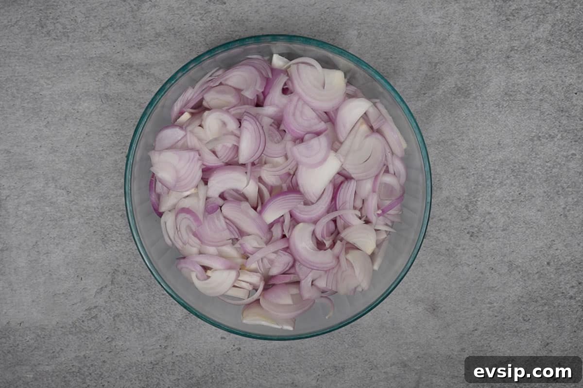 Sliced onions in a bowl.