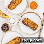 three white plates with slices of low sugar pumpkin bread on them.