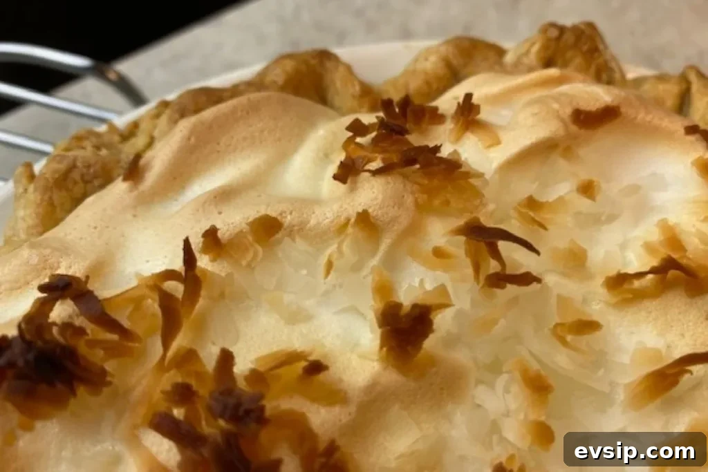 close up of meringue on coconut pie